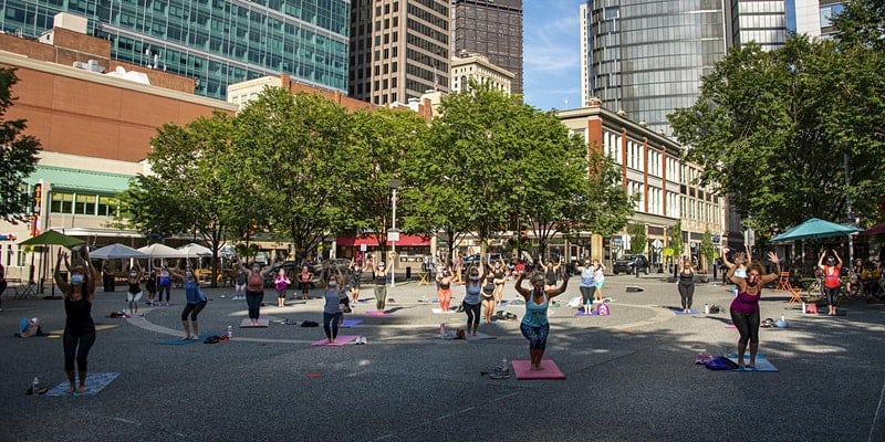 Yoga in Market Square is one of the outdoor activities in Pittsburgh to do right now. 
